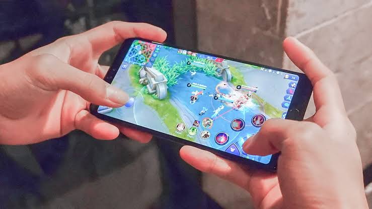 Smartphone displaying a fictional mobile game at an Australian gaming technology exhibition